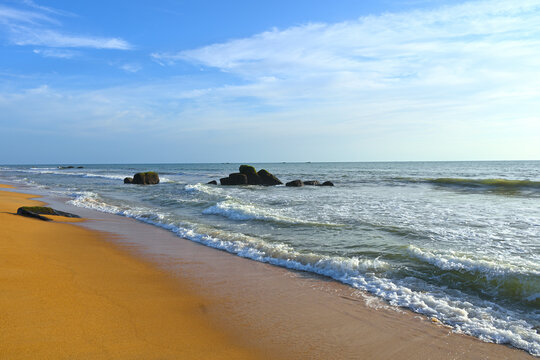 Group of rocks partially submerged in sea water on Kodi Beach