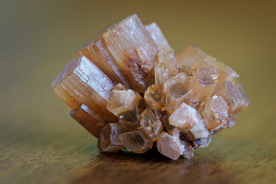 A small druse of aragonite lying on the table.
