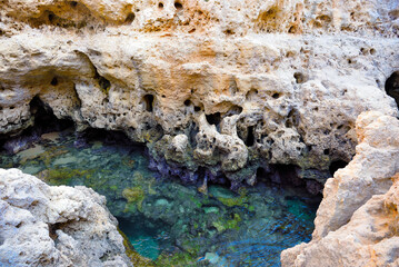 Algar Seco is a rock formation near Carvoeiro the rocks were formed over thousands of years by wind and waves today the resulting caves are a popular tourist destination in the Algarve Portugal