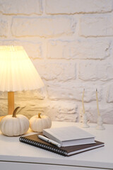 Create a Cozy Home Decor Atmosphere Using Notebooks and Natural Elements for Comfort.