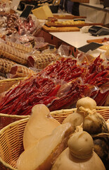 bustling neighborhood market stall featuring traditional Italian cheese cured meats and vacuum-packed foods