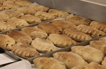 typical Italian dish called panzerotti which are small stuffed sandwiches cooked in a wood oven
