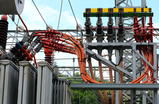 high voltage transformer with fat cables that carry a lot of electrical current of the nuclear power plant