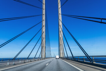 Obraz premium High-speed road bridge view from a fast-moving car. Road and railway blidge connecting Denmark and Sweden.