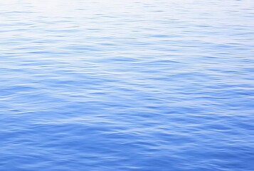 Naklejka premium Mirror Sea An unusually calm sea where waves are minimal and the