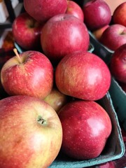 red apples on a market stall