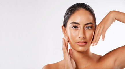 Naklejka premium Beauty, space and portrait with woman and hand in studio for self care, cosmetics and dermatology. Collagen, facial and spa treatment with face of female model on white background for skincare mockup