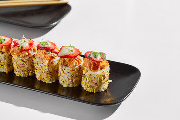 Gourmet Pistachio and Strawberry Tuna Tartare Sushi Rolls on Black Plate