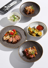 Gourmet Meat Dishes Elegant Presentation with Fine Dining Aesthetic
