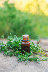 Thyme extract in a bottle. Selective focus.
