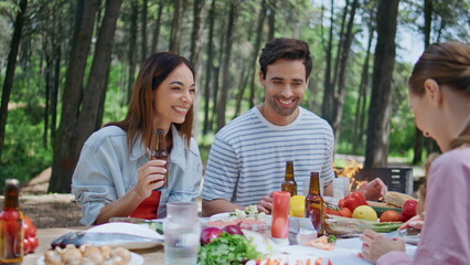 Friends laughing forest picnic having fun at bbq party closeup. Happy people