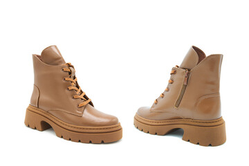 Fashionable leather lace-up boots isolated on white background. View from all sides.	