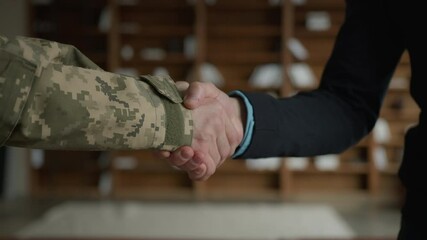 Close up male handshaking. Two unrecognizable men military soldier veteran warrior guy veteran officer grabbing arms shaking hands businessman entrepreneur gratitude respect greeting handshake indoors