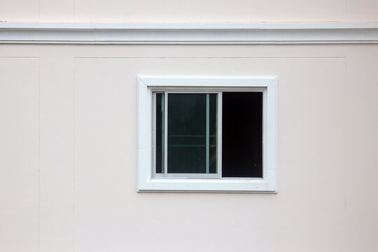 Sliding window frame and cement wall, Window of an ancient building.