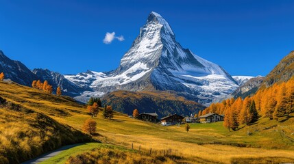 Fototapeta premium Majestic Alps mountain range in Switzerland, snow-covered peaks under a clear blue sky.