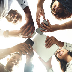 Obraz premium Employees, hands and tech for meeting in huddle, campaign project and research media trend. Staff, low angle and office for feedback on audience engagement, online and connect for news in circle