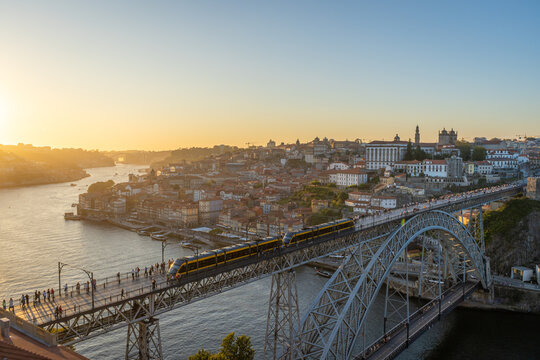 Porto City, Douro River and Dom Luis bridge I with Tram from Tourist Viewpoint Miradouro da Serra do Pilar at Sunset. Portugal