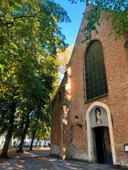 Fototapeta premium Romantic Facades of Brugge: Exploring Belgium's Medieval Architecture and Picturesque Brick Houses