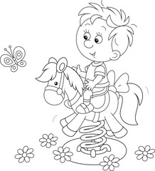 Cheerful little boy swinging on a toy horse on a playground in a park, black and white outline vector cartoon illustration for a coloring book