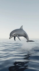 Fototapeta premium A graceful dolphin leaps majestically from the deep blue ocean, splashing water droplets as it glides freely in the vast sea