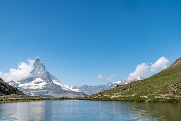 Riffelsee Lake and Matterhorn mountain in the Alps with reflection. Alpine scene in Switzerland