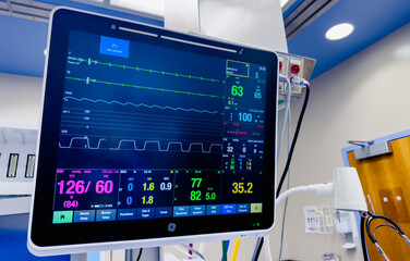 hospital monitors displaying vital signs, including heart rate, oxygen levels, and blood pressure....