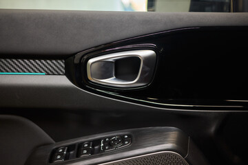 Stylish and Modern Car Interior Design Featuring Carbon Fiber Accents and Ambient Lighting