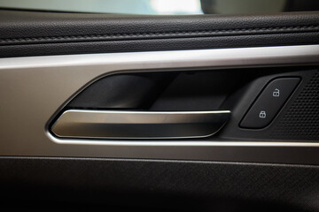 Naklejka premium A car door with trim showcasing automotive design details