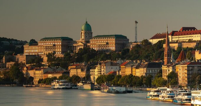 Budapest, Hungary - September 22, 2024: Captivating Sunrise View of Buda from Budapest's Margit Bridge. Timelapse, zoom in transition.