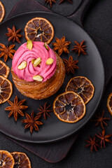 Sweet craffin or panettone garnished with raspberry and pistachio flavored cream