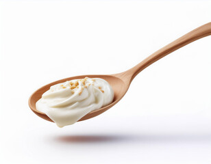 wood spoon filled with Greek yogurt isolated