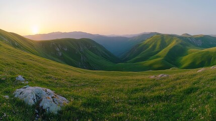 Obraz premium Panoramic view of the green mountains and hills at sunset. Gumbashi Pass in North Caucasus, Russia. Beautiful summer landscape.