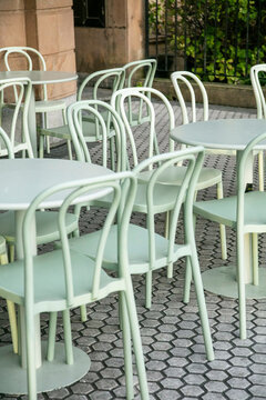 Chairs and tables on a European sidewalk