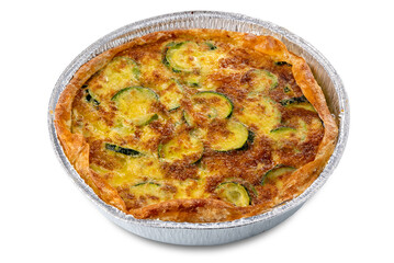 Zucchini and egg savoury pie, savory cake in aluminum foil pan freshly baked cut out.
