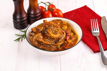 Italian cuisine - ossobuco with sauce