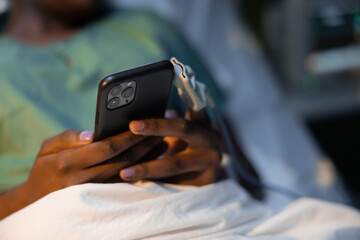 Close up shot on African girl's hands with phone in hands chatting with family.
