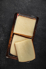 Raclette cheese tasty food dish fresh delicious gourmet food background on the table rustic food top view copy space top view