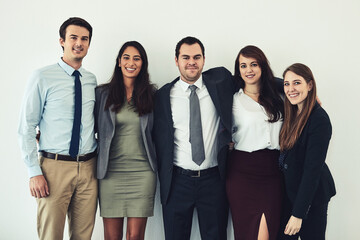 Fototapeta premium Portrait, hug and team of happy business people together for solidarity, integrity or about us. Smile, collaboration or staff embrace for diversity, support and sales group on white studio background