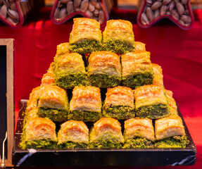 Baklava varieties on dessert store. Turkish desserts. Traditional Baklava with pistachio.