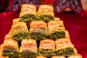 Baklava varieties on dessert store. Turkish desserts. Traditional Baklava with pistachio.