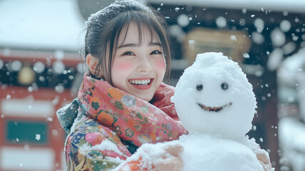雪だるまを作る着物姿の少女