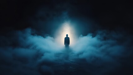 A lone figure stands in a misty, blue-lit environment, creating a mysterious and atmospheric scene.