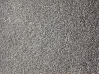 The textured surface is gray as a background. Felt