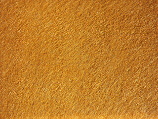 The textured surface is brown, red in color as a background. Felt