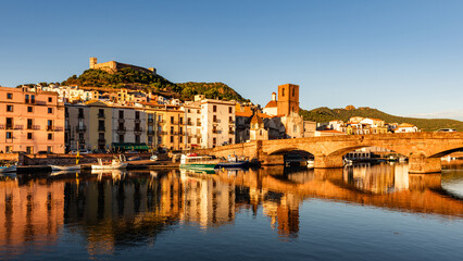 Beautiful view of the town of Bosa at golden hour, island of Sardinia, Italy.