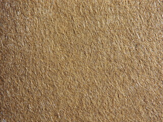The textured surface is brown, red in color as a background. Felt