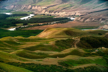 Nine Curves Eighteen Bends, one of the scenic areas in Kalajun Grassland, formed by Kuokesu River twists and turns at the bottom of Kuokesu Grand Canyon like a dragon, Tekes County, Xinjiang, China