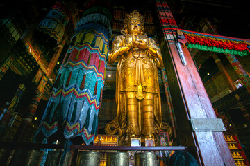 Ulaanbaatar, Mongolia - August 5, 2024 - Scene of statue of Avalokitesvara, a 26-metre (85 ft) statue made of gilded bronze and precious stones in Gandantegchinlen Monastery