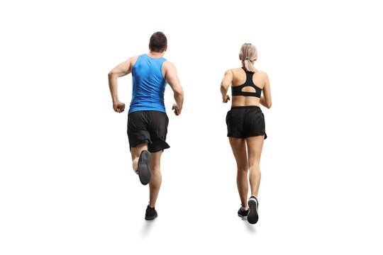 Rear view shot of a man and woman jogging