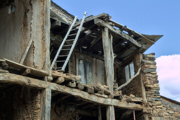 Ruined house made of stone and wood